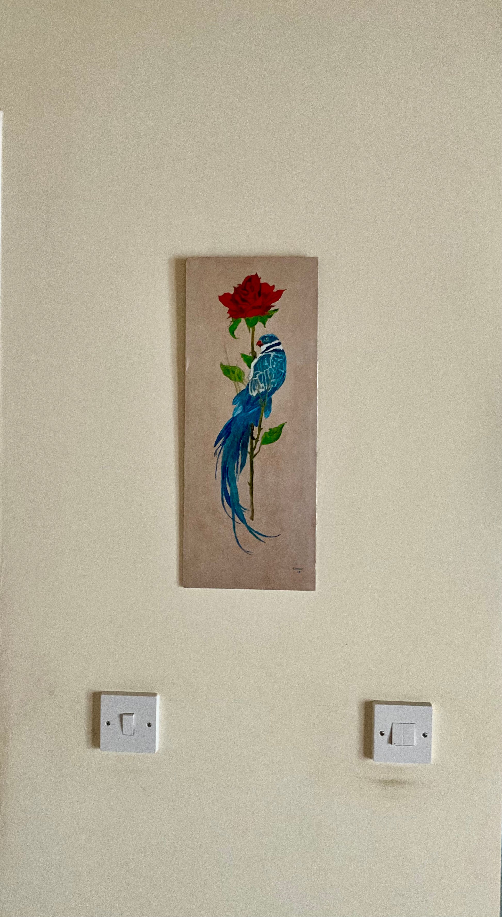This original oil painting features a stunning blue bird of paradise gracefully perched on a vibrant red rose stem. The painting's dimensions, at 8" x 19", make it the perfect size for adding a touch of beauty to any room.