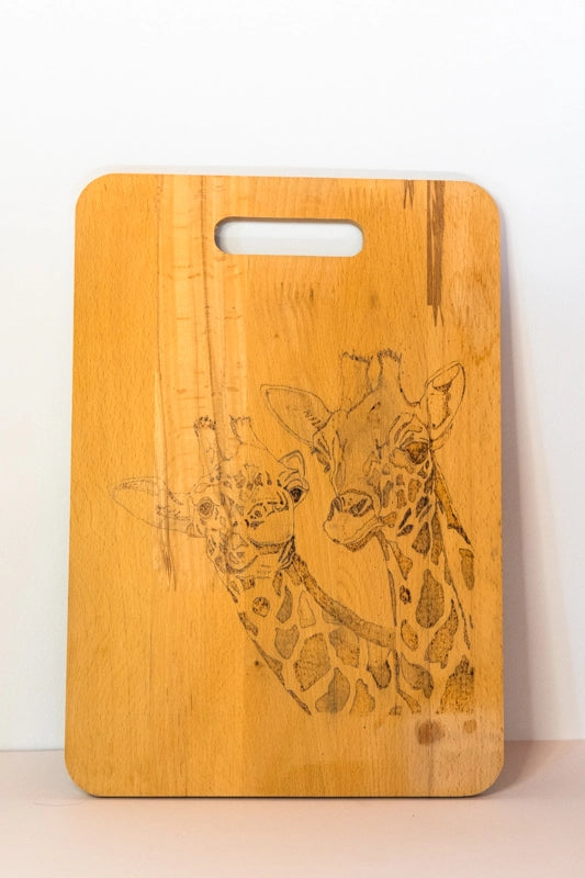 Beach wood chopping board, wood-burnt with two giraffes