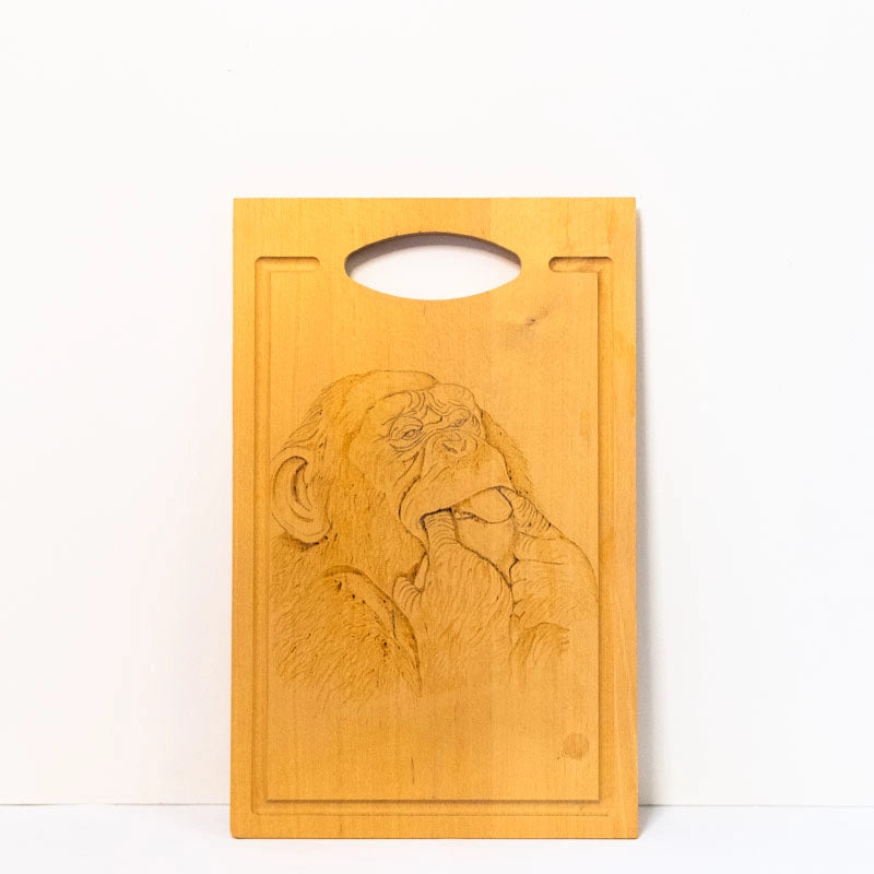 'Beachwood chopping board wood-burnt with picture of a Cheeky Monkey.  14” x 9”. 36cm x 23cm