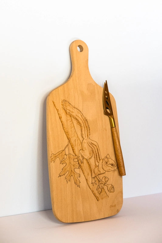 Beach wood cheese board. Wood-burnt with design of chipmunk on branch. With attached cheese knife.