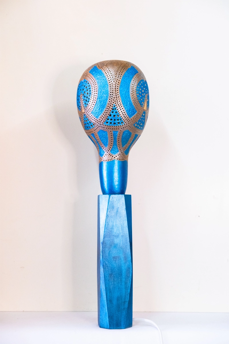 Tall blue Gourd lamp, mains powered on wooden shaped plinth. Woodburnt, carved and finished in acrylic 58cm tall