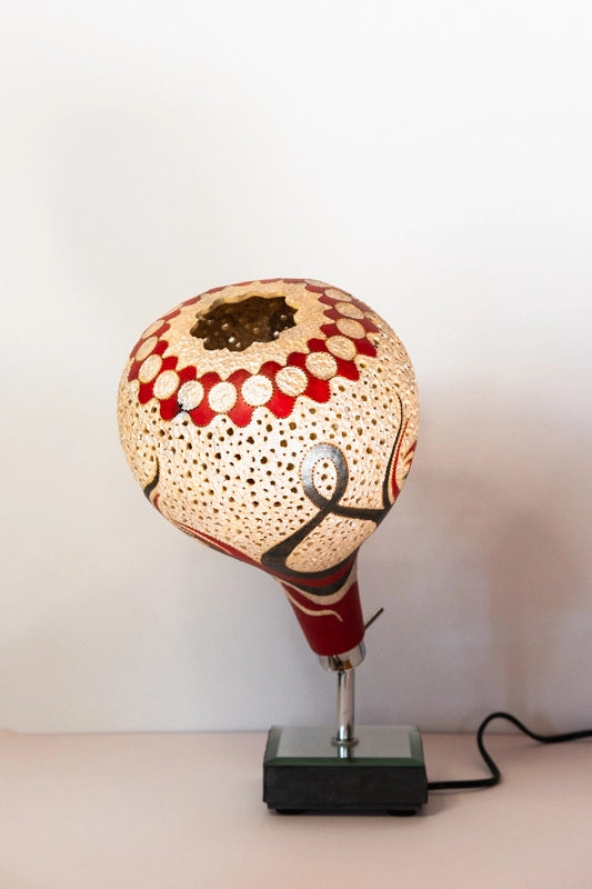 Decorative gourd lamp, wood-burnt, carved and finished in Wellburn inks. Mounted on a mirrored wooden base.