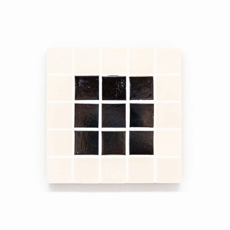 Set of 4 coasters. Ceramic and glass tile.  A decorative addition  to your home.  Each coaster 10X 10cms.  ﻿White/black