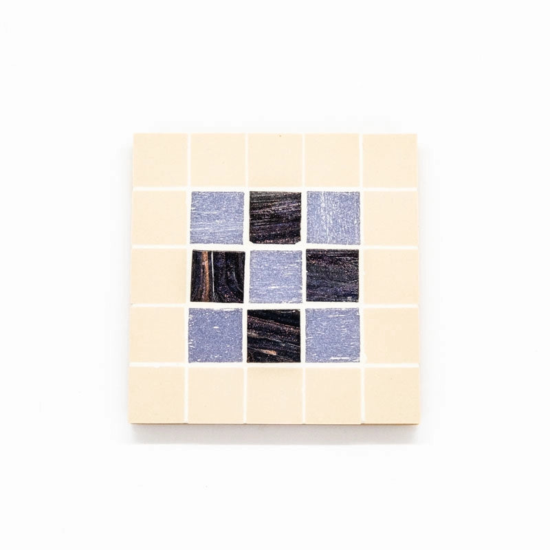 Set of 4 coasters. Ceramic and glass tile.  A decorative addition  to your home.  Each coaster 10X 10cms.  Mauve/white.