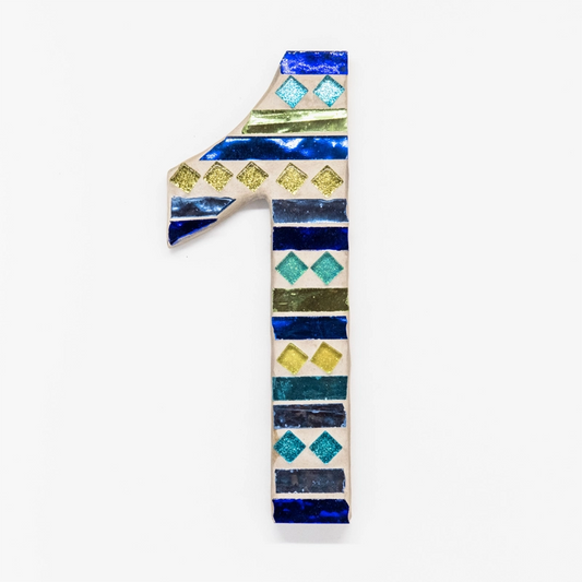 Small house number in blues/greens.