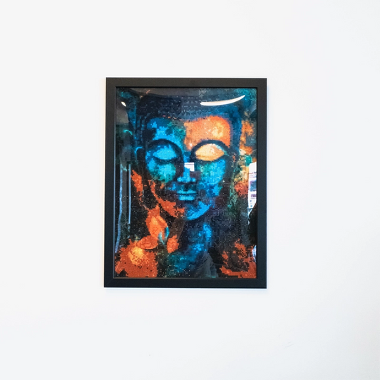 Beautiful eye-catching diamond painting of a Buddha in hues of blues, reds and orange.  Individually placed, faceted