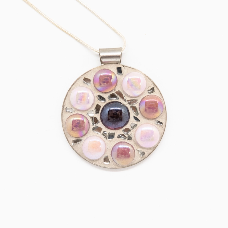 Pretty in pink, this pendant will add a touch of artistry to any neckline.