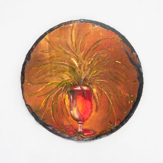 Printed on slate,vase in red and orange hues 